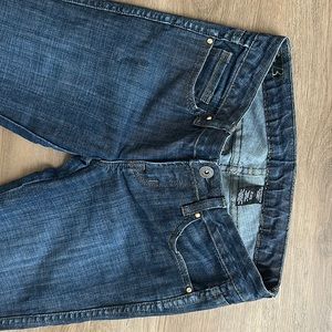 Buffalo dark wash. Metallic gold stitch and pocket detail. Great fashion denim!